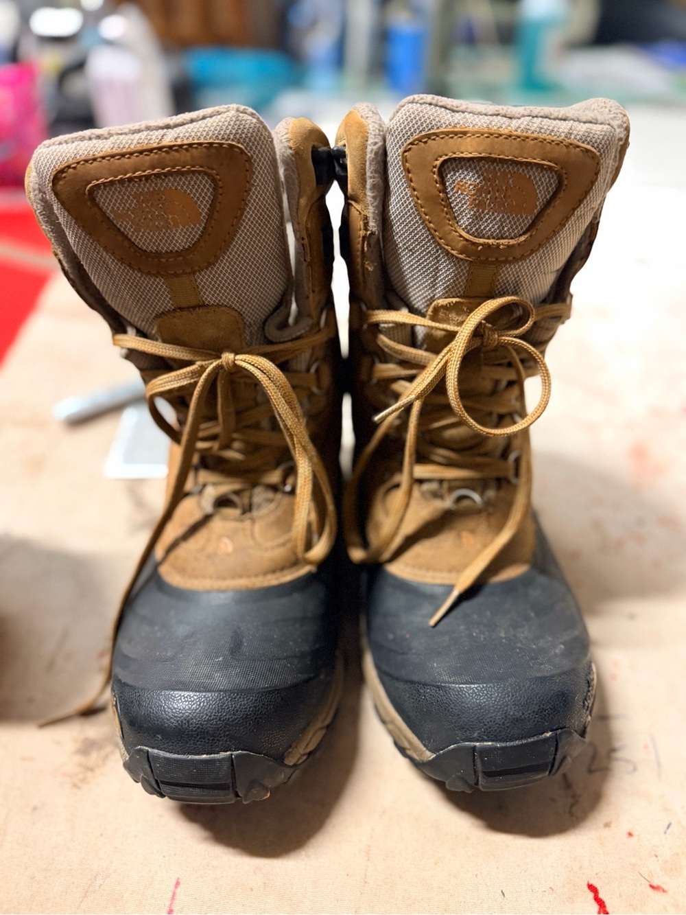 The North Face Tan and Black hi king insulated boots